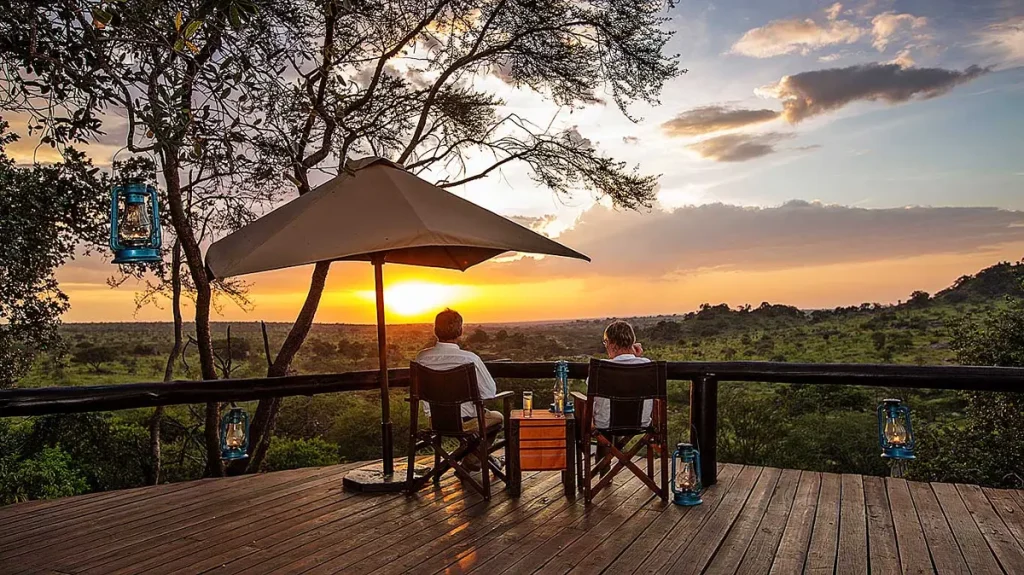 Guests at Elewana Serengeti Migration Camp during the sunset hours - honeymoon in Tanzania